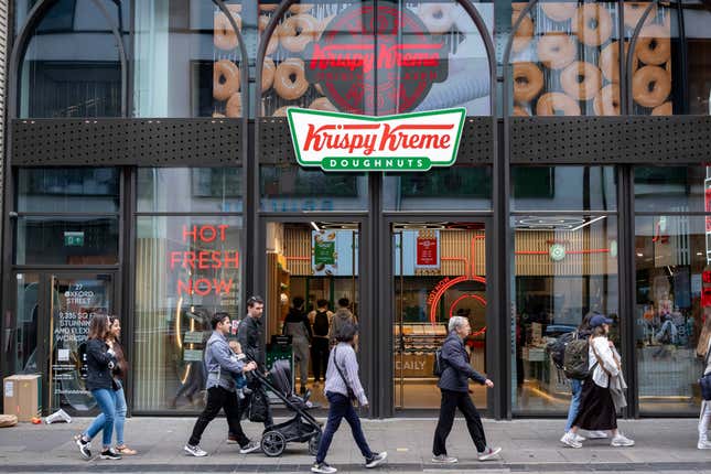 People outside Krispy Kreme in London. 