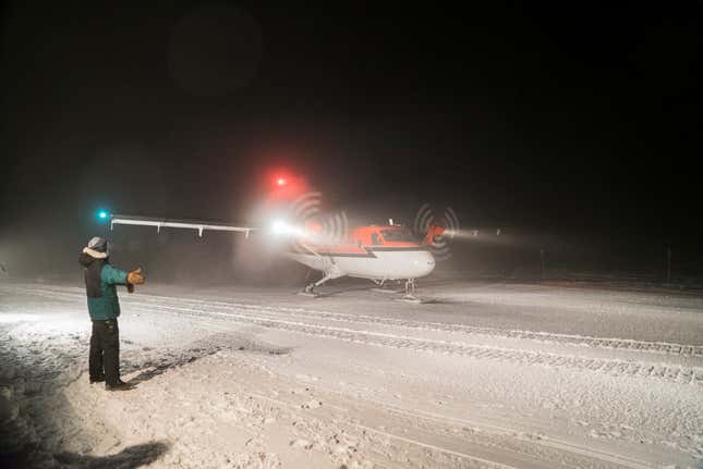 A Twin Otter aircraft that can land on skis taxis on the skyway at Amundsen-Scott South Pole Station. (National Science Foundation via AP/Robert Schwarz)