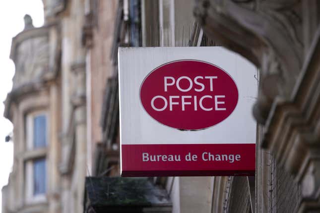 A logo of post office is displayed in London, Wednesday, Jan. 10, 2024. Britain&#39;s Prime Minister Rishi Sunak says he will introduce measures to overturn the convictions of more than 700 post office branch managers who were wrongly accused of theft or fraud because of a faulty computer system. (AP Photo/Kin Cheung)