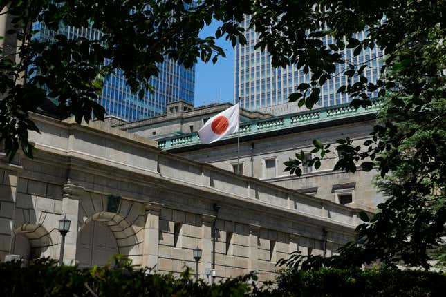 FILE - The headquarters of Bank of Japan (BOJ) is seen in Tokyo on Aug. 18, 2023. The Bank of Japan kept its longstanding easy credit policies unchanged on Tuesday, Dec. 19, saying it will watch price and wage trends before raising its negative benchmark interest rate. (AP Photo/Shuji Kajiyama, File)