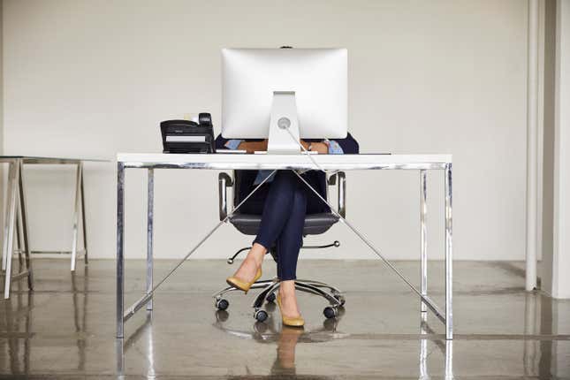 Woman behind a desk