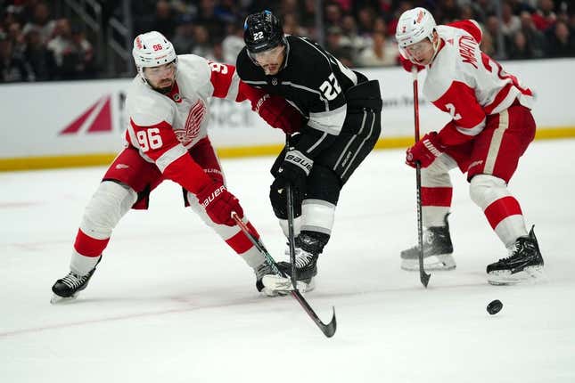 Jan 4, 2024; Los Angeles, California, USA; Detroit Red Wings defenseman Jake Walman (96) and defenseman Olli Maatta (2) battle for the puck with LA Kings left wing Kevin Fiala (22) in the second period at Crypto.com Arena.