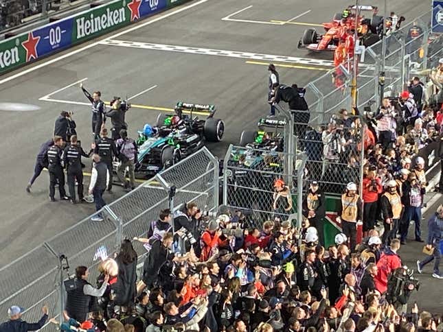 A photo of russell waving at the crowd after his win