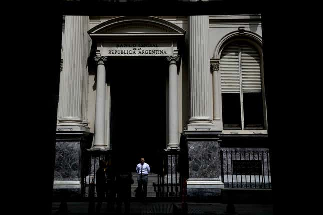 A guard stands at the entrance of the Central Bank in Buenos Aires, Argentina, Tuesday, Nov. 21, 2023. (AP Photo/Natacha Pisarenko)