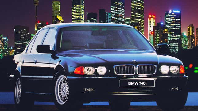 A photo of a BMW 7 Series sedan from 1998 parked in front of a city skyline. 