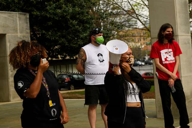 Frances Wallace, 20, (L), an Amazon.com Inc. fulfillment center worker, speaks during a protest in solidarity with Black Lives Matter, Stop Asian Hate, and the unionization of Amazon workers at Kelly Ingram Park on March 27, 2021, in Birmingham, Alabama.