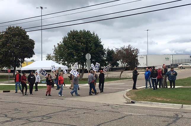 United Auto Workers picket outside the Flint Processing Center where multiple people were hit on Tuesday, Sept. 26, 2023, in Swartz Creek, Mich. About five people picketing in the United Auto Workers strike outside the Flint-area General Motors plant suffered minor injuries Tuesday when a vehicle leaving the plant struck them, police said. (Roberto Acosta/The Flint Journal via AP)