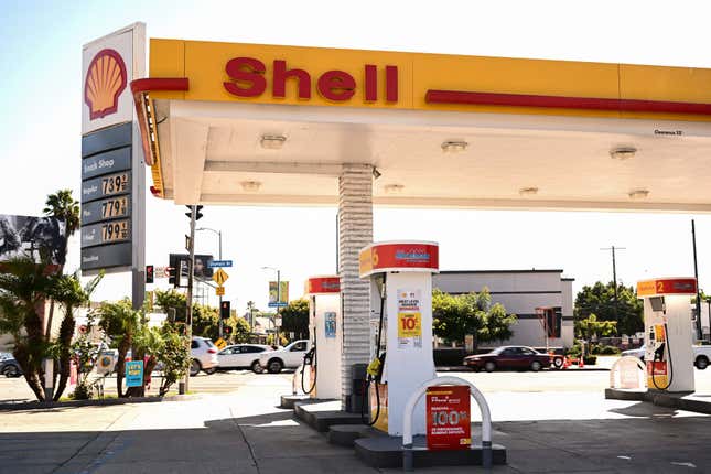 A sign shows gasoline fuel prices above average at over seven and approaching eight dollars a gallon at a Shell gas station in Los Angeles, California, on October 5, 2023. 
