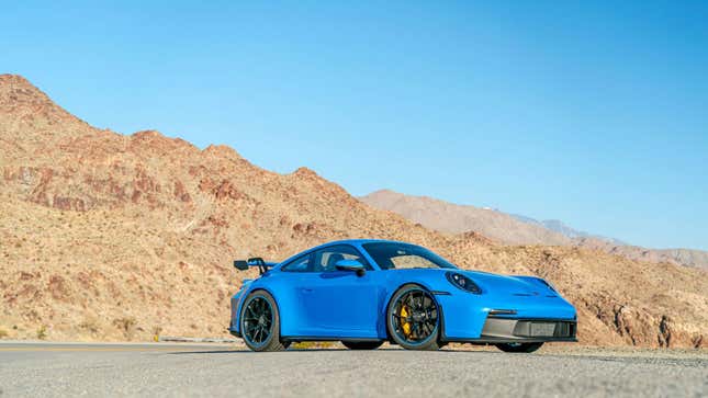 A photo of a blue Porsche 911 sports car. 