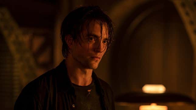 Robert Pattinson looks sad with wet hair in an image from The Batman.