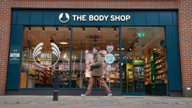 People walk past a Body Shop store in Canterbury, England, Tuesday, Feb. 13, 2024. The Body Shop, the British beauty and cosmetics retail chain, says it&#39;s appointed insolvency administrators after years of financial struggles. The retailer grew from a single shop in 1976 to become one of the most recognizable retailers on the British high street with hundreds of stores in the United Kingdom and beyond. (Gareth Fuller/PA via AP)