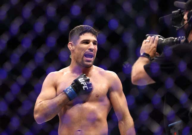 Aug 7, 2021; Houston, Texas, USA; Vicente Luque (blue gloves) reacts to the fight against Michael Chiesa (red gloves) during UFC 265 at Toyota Center.