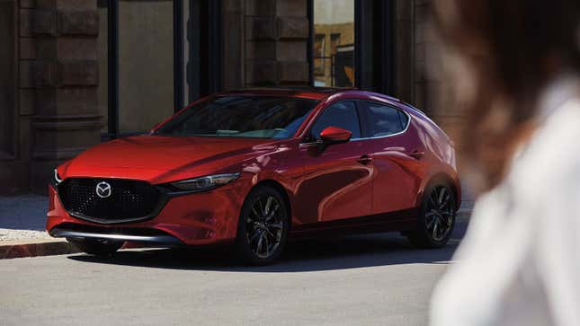 A photo of a red Mazda 3. 