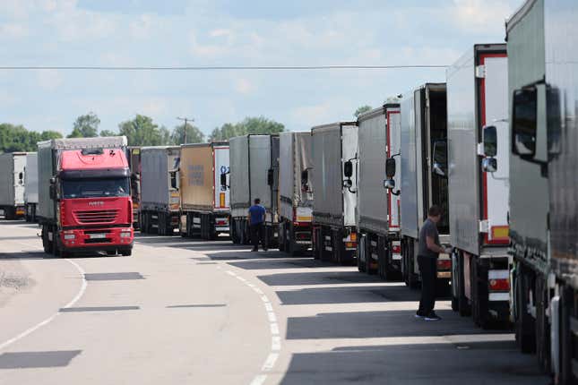 FILE - Trucks stands at the post-customs international checkpoint Chernyshevskoye at the Russian-Lithuanian border in Kaliningrad region, Russia, Wednesday, June 22, 2022. The Baltic states of Estonia, Latvia and Lithuania have in a jointly coordinated move banned vehicles with Russian license plates from entering their territory as part of the European Union’s recent new interpretation of sanctions against Moscow. (AP Photo, File)