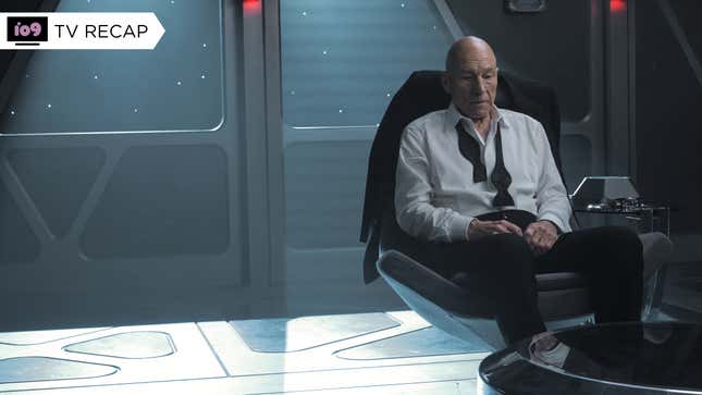 Jean-Luc Picard, wearing an unbuttoned dress shirt and an untied bow tie, sits in a futuristic office.