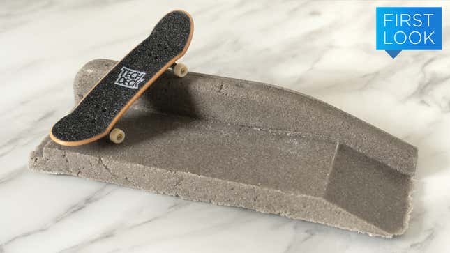A miniature Tech Deck skateboard on top of a D.I.Y. Concrete creation.