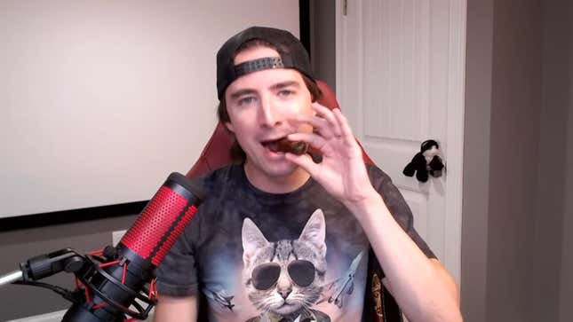 Keith Gill smokes a cigar while talking about GameStop. 