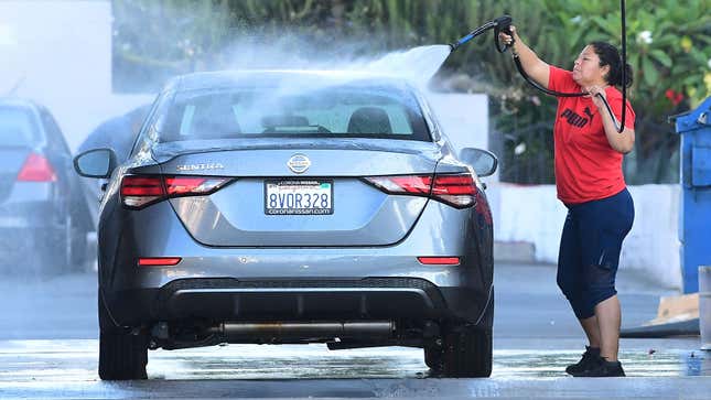 A Nissan sedan being washed 