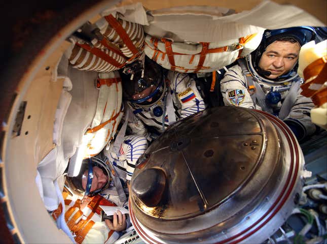 The three astronauts seen in the spacecraft shortly after landing.