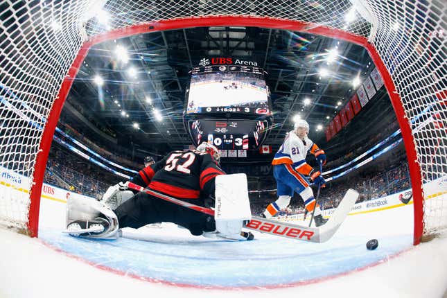 ELMONT, NEW YORK - MARCH 19: Kyle Palmieri #21 of the New York Islanders scores a third period goal against Pyotr Kochetkov #52 of the Carolina Hurricanes at UBS Arena on March 19, 2024 in Elmont, New York. Hurricanes defeated the Islanders 4-1. (Photo by Bruce Bennett/Getty Images)