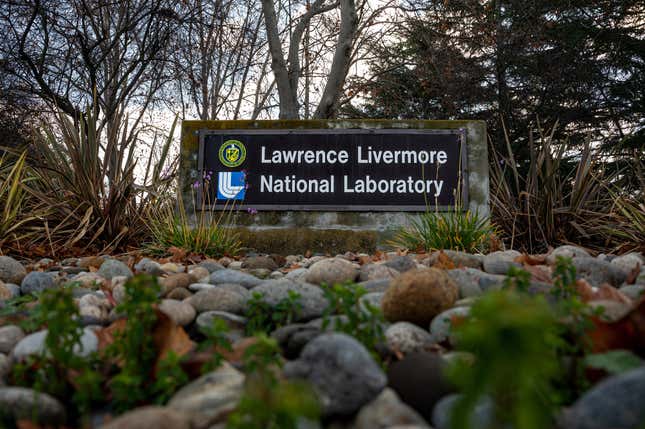 signage for the Lawrence Livermore National Laboratory surrounded by trees and stones