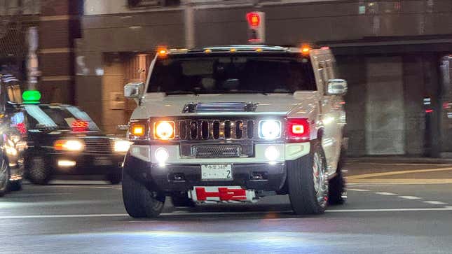 Front view of a lowered white Hummer H2