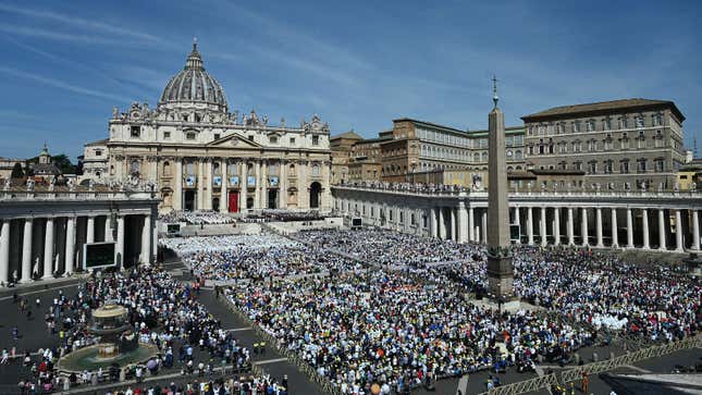 A photo showing crowds gathered round the cathedral in The Vatican city. 