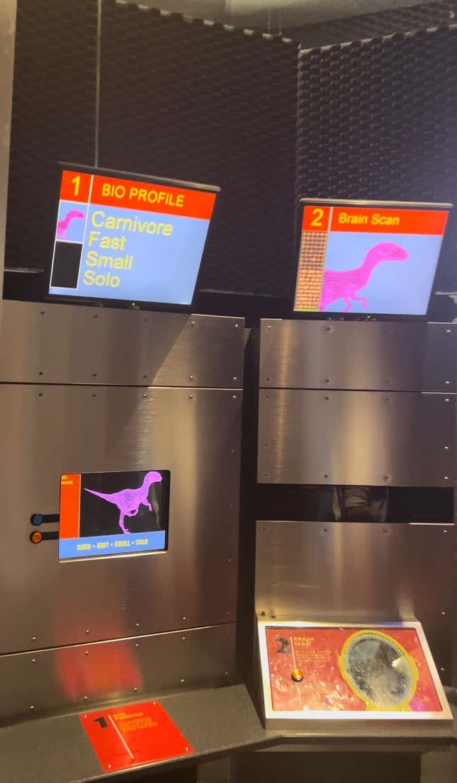 a station with screens to splice your dna sample with a dinosaur