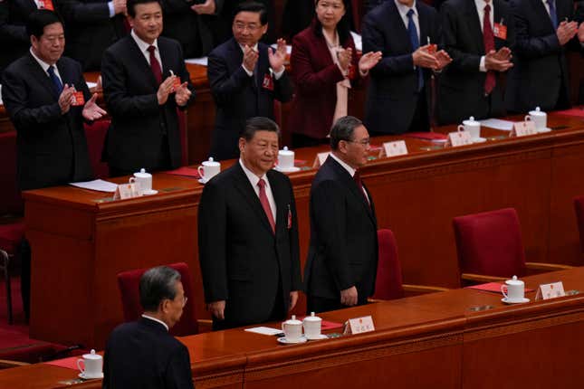 Chinese President Xi Jinping, center left, and his Premier Li Qiang, center right, arrive to the closing session of the National People&#39;s Congress (NPC) at the Great Hall of the People in Beijing, Monday, March 11, 2024. (AP Photo/Andy Wong)