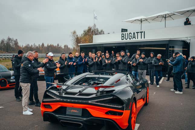 Rear 3/4 view of the black and orange Bugatti W16 Mistral World Record Car