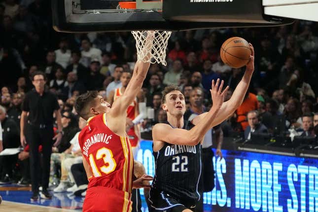 Nov 9, 2023; Mexico City, MEX; Orlando Magic forward Franz Wagner (22) shoots the ball against Atlanta Hawks guard Bogdan Bogdanovic (13) in the first half during the 2023 NBA Mexico City Game at the Arena CDMX.