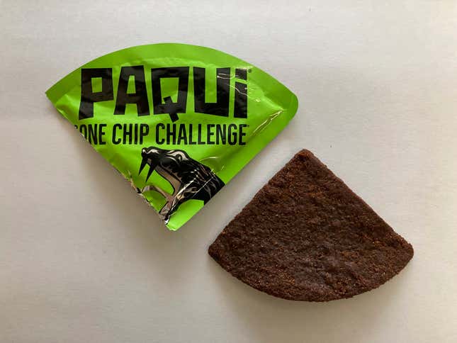 A Paqui One Chip Challenge chip is displayed in Boston, Friday, Sept. 8, 2023. The death of a Massachusetts teenager after his family said he ate an extremely spicy tortilla chip has led to an outpouring of concern about the social media challenge and prompted retailers to pull the product from their shelves at the manufacturer&#39;s request. (AP Photo/Steve LeBlanc)