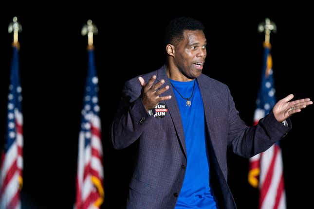 Republican Senate candidate Herschel Walker greets the crowd during a rally with former President Donald Trump on September 25, 2021, in Perry, Georgia. Georgia Secretary of State candidate Rep. Jody Hice (R-GA) and Georgia Lieutenant Gubernatorial candidate State Sen. Burt Jones (R-GA) also appeared as guests at the rally.