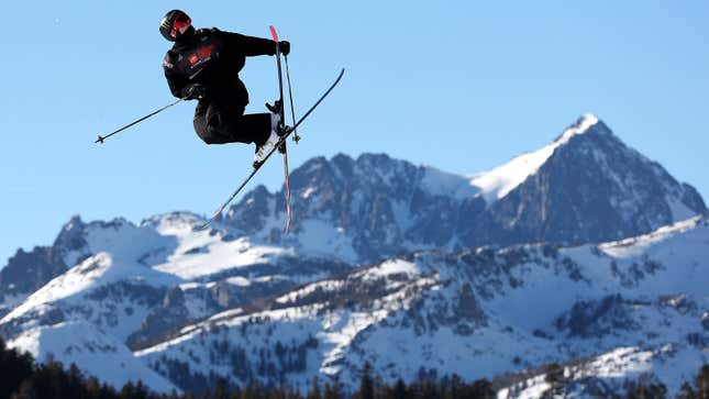 A photo of a skier performing a trick off a jump. 