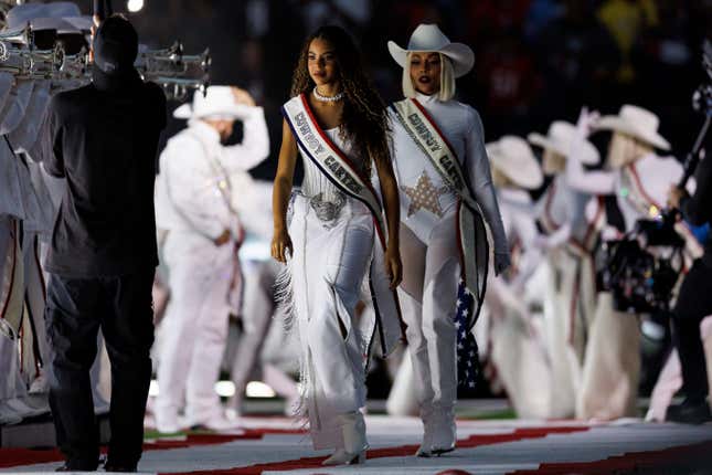 Blue Ivy walks onto the field for the Beyoncé halftime show during an NFL football game between the Baltimore Ravens and the Houston Texans, at NRG Stadium on December 25, 2024 in Houston, Texas.