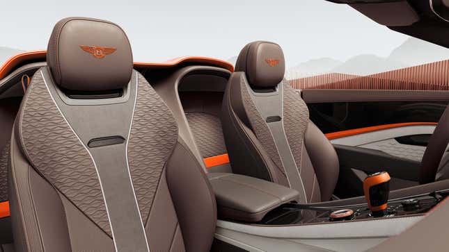 Front seats of an orange Bentley Batur Convertible
