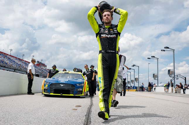 Ryan Blaney, driver of the No. 12 Menards/Moen Ford, walks the grid in preparation to qualify for the NASCAR Cup Series Cook Out Southern 500 at Darlington Raceway on September 03, 2022 in Darlington, South Carolina.