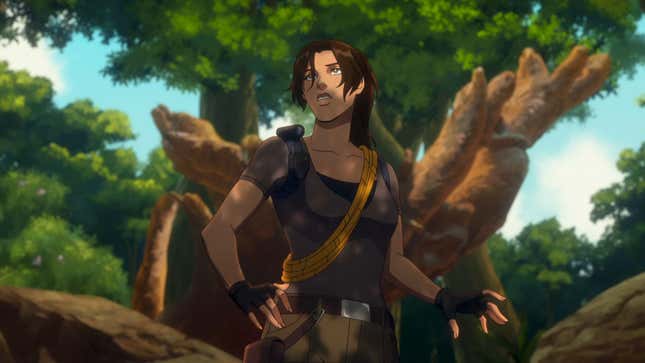 Lara Croft stands looking concerned, in front of a straight rock.