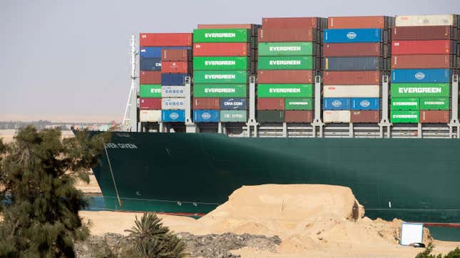 People watch as the container ship ‘Ever Given’ is refloated, unblocking the Suez Canal on March 29, 2021 in Suez, Egypt. 