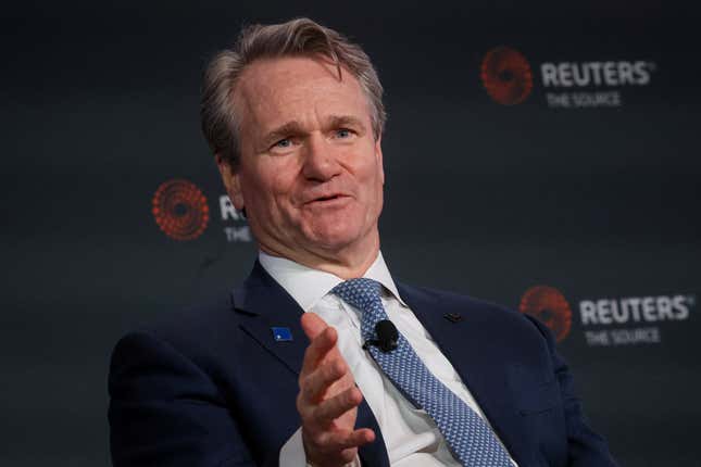 Man in suit on stage at a Reuters event