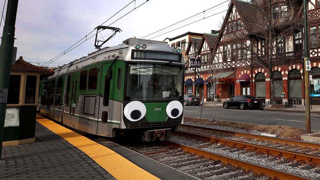 A photo of a T Line train in Boston with eyes on the front. 