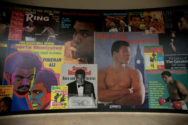 FILE - Large posters of mostly Sports Illustrated magazine covers are displayed at the &quot;I Am The Greatest, Muhammad Ali&quot; exhibition at the O2 arena, which hosts high profile boxing fights in London, June 4, 2016. Sports Illustrated will continue operations after the company that owns the brand reached an agreement with a new publisher for its print and digital products, Monday, March 18, 2024. (AP Photo/Matt Dunham, File)