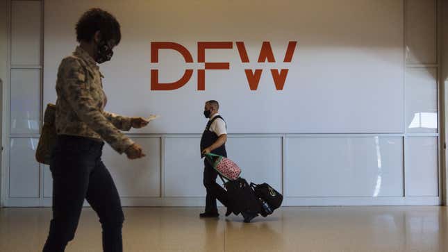 A photo of passengers at Dallas airport. 