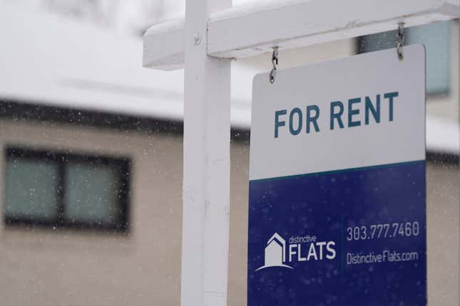 FILE - A for rent sign stands outside a single-family home on the market Saturday, Feb. 10, 2024, in Denver. A record number of Americans who rent are now considered cost-burdened, with 30% or more of their income going toward rent and utilities. Companies like Flex, which let you divide your rent into smaller installments via a line of credit or loan, say they’re part of the solution. (AP Photo/David Zalubowski, File)