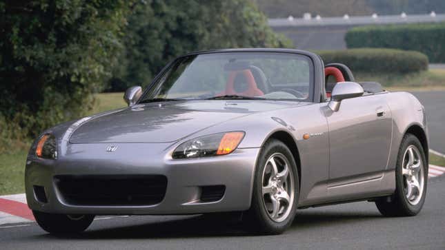 A photo of a silver Honda S2000. 