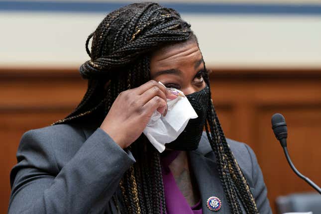 Rep. Cori Bush, D-Mo., wipes away a tear as she prepares to testify about her experience being raped and a subsequent abortion, Thursday, Sept. 30, 2021, during a House Committee on Oversight and Reform hearing on Capitol Hill in Washington.