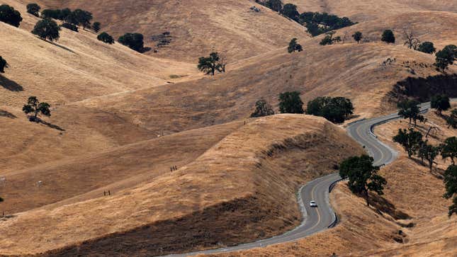 A car driving down a hill