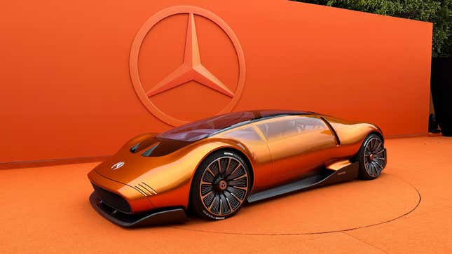 Front 3/4 view of the orange Mercedes-Benz Vision One-Eleven concept in front of an orange background