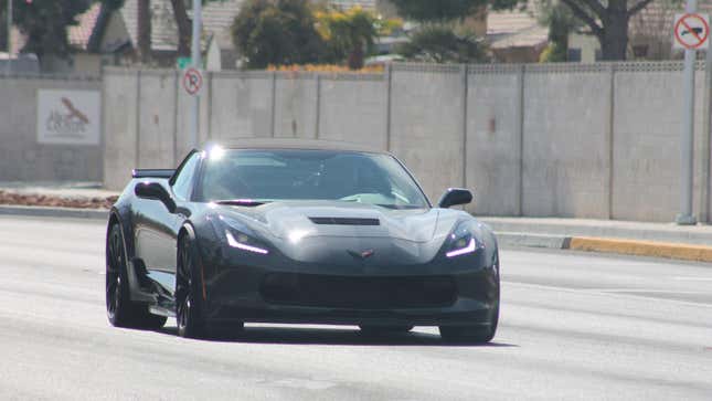 A black C7 Corvette Z06 driving on a road in Nevada