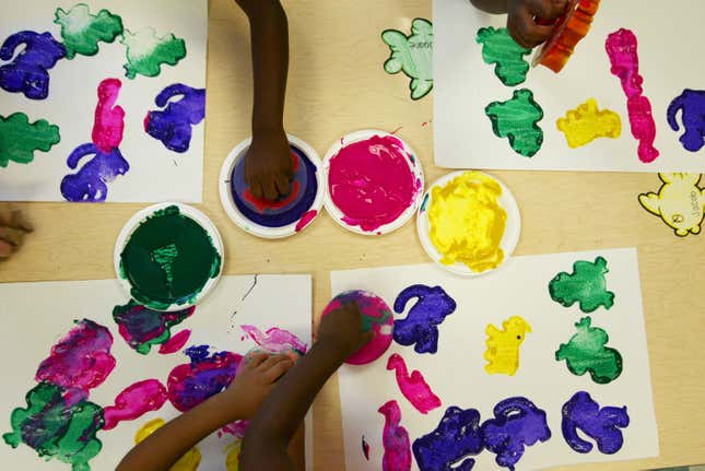 BRADDOCK, PA - AUGUST 24: Young children work on a paint project at the 4 Kids Early Learning Center August 24, 2004 in Braddock, Pennsylvania. The center is funded mostly by The Heinz Endowments. The average family income of children at the center is about $13,000 a year. The H.J. Heinz Co., based in Pittsburgh, once was one of the former industrial center's major employers. Now, Heinz's manufacturing has gone global and the impact on Pittsburgh is less. The Heinz family and its namesake foundation are no longer tied to the company, but their influence lives on, through philanthropy and the involvement of John Kerry's wife, Teresa Heinz Kerry, the widow of the late U.S. Senator H. John Heinz III. (Photo by Chris Hondros/Getty Images)
